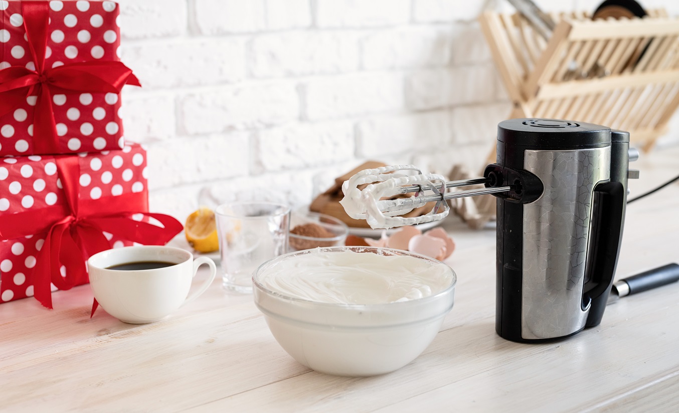 whipped-cream-glass-bowl-with-mixer-wooden-white-table.jpg