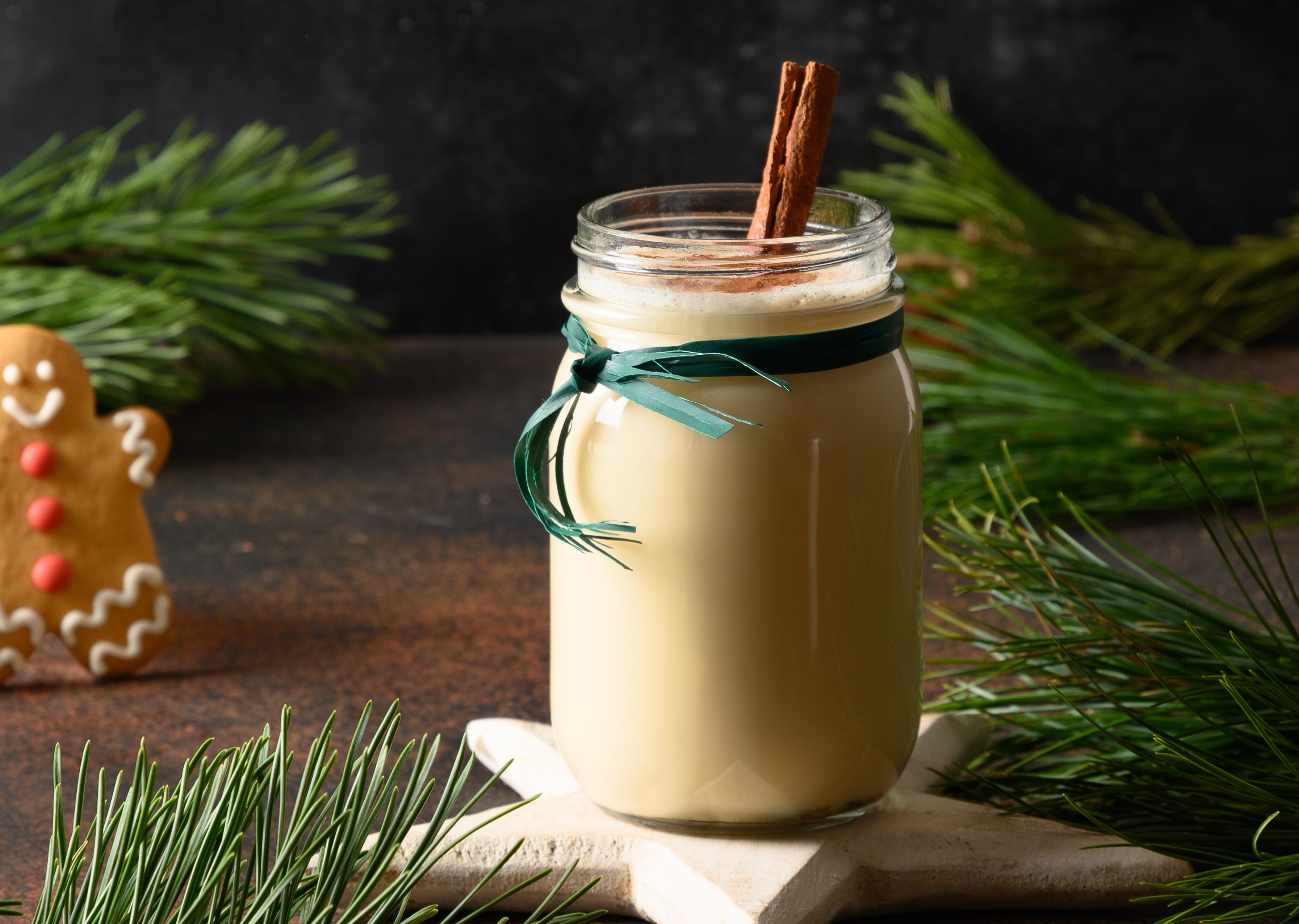 holiday-christmas-eggnog-beverage-mason-jar-with-gingerbread-brown-background.jpg