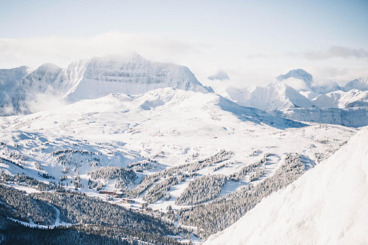 Snow-covered mountains under a clear blue sky.
