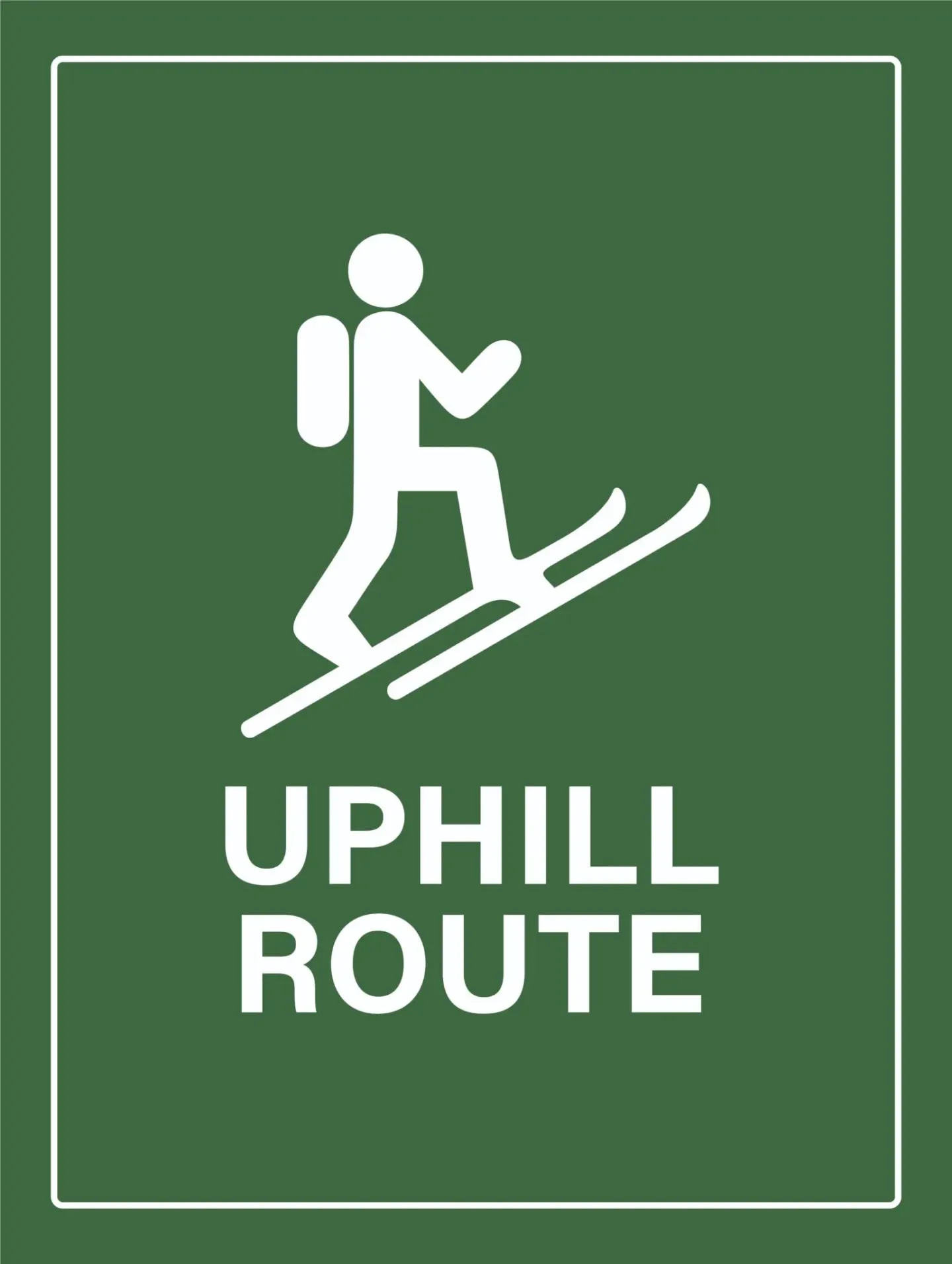 White hiker icon and “UPHILL ROUTE” text on green sign.