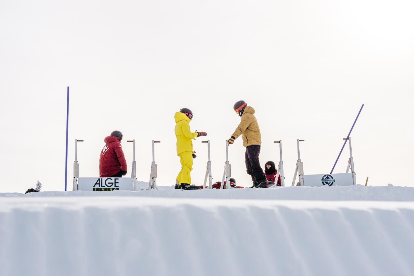 Skiers on top of a run.